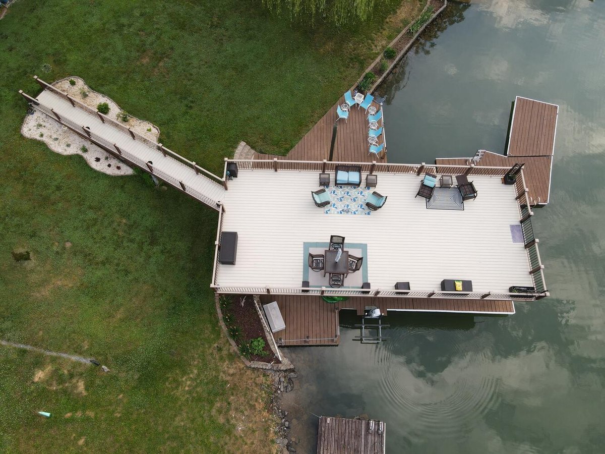 Custom-built lakeside dock and lounge deck by Grace Alon Builders in Roanoke Metropolitan