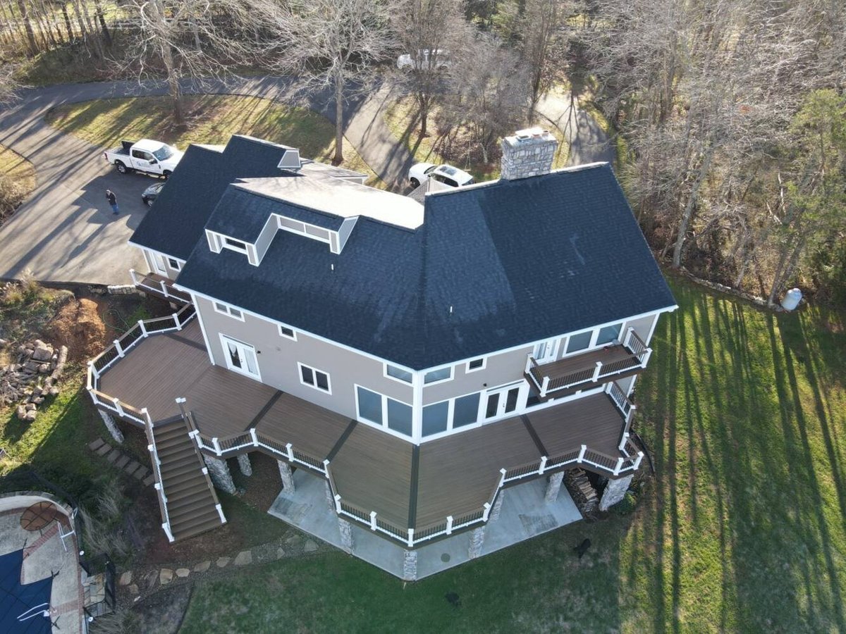 Grace Alon Builders custom home in Roanoke Metropolitan with expansive wrap-around deck and stone columns.jpg
