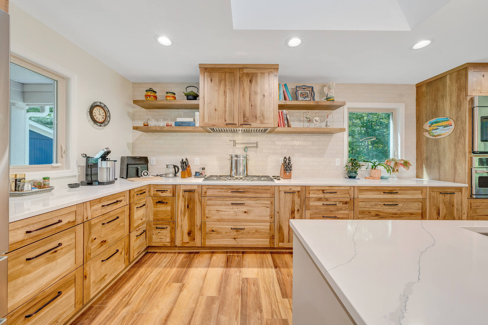 Custom kitchen in Smith Mountain Lake home by Grace Alon Builders with wood cabinetry and quartz countertops